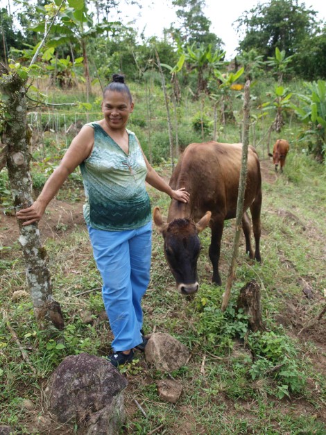 Maria Helena with one of her cows